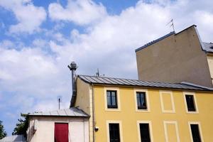 Vintage House with White Cloud and Blue Sky in France. photo