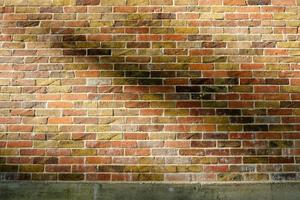 Brick Wall with Natural Light Beam Background. photo