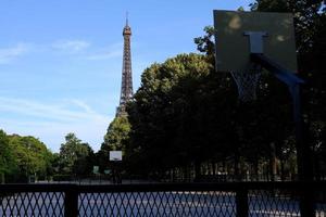 Scenery of Eiffel Tower from The Champ de Mars Field of Mars where is a large public green space in Paris, France. photo