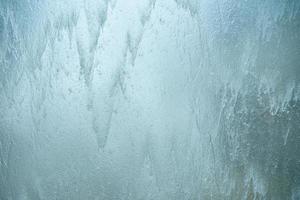 Falling water on glass wall , blurred background. photo