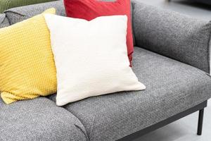 a part of pillows on sofa in living room. close up home interior concept soft pillow in bedroom. home sweet home interior ideas photo