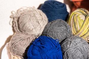 Balls of wool in various colors. close up view on wool knitting balls in different colors. photo