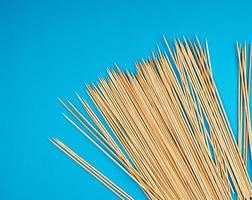 wooden bamboo sticks on a blue background photo