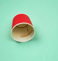 red paper cup with corrugated edges for hot drinks photo