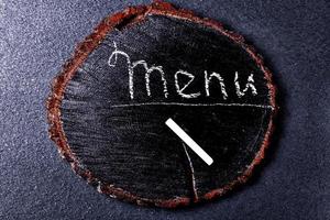 menu inscription in chalk on a wooden blackboard photo