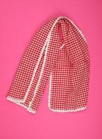 white red checkered kitchen towel on a pink background photo