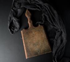 empty vintage wooden brown board and black gauze napkin photo