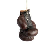 pair of very old vintage brown leather boxing gloves hanging on a rope photo