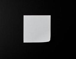empty white sheet of paper on a black background photo