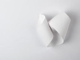 white piece of paper is twisted,  white background photo