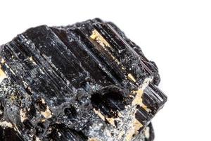 macro mineral stone sherle, schorl, black tourmaline on white background photo