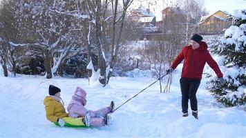 Family of dad and kids vacation on Christmas eve outdoors video