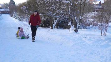 Family of dad and kids vacation on Christmas eve outdoors video