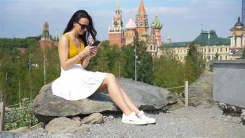 Happy young urban woman in european city. video