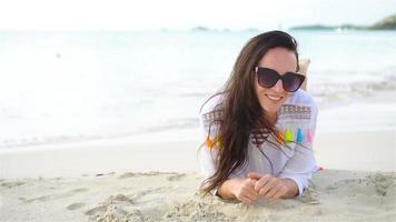 Young beautiful woman on beach during tropical vacation video