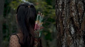 Asian women with long black hair resting her head on a brown wood video