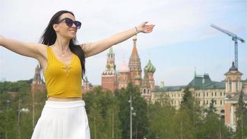 Happy young urban woman in european city. video