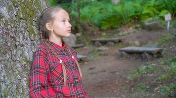 Beautiful happy little girl in mountains in the background of fog video