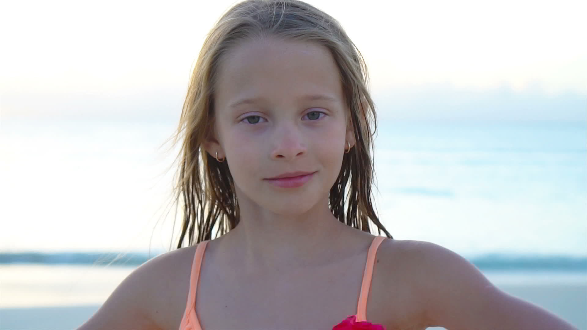 Portrait of little girl looking at camera and smiling background