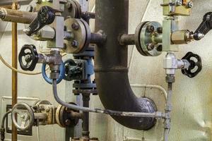 Pipes and faucet valves of heating system in a boiler room photo