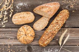 Background of fresh bread and bakery on an old vintage planked wood table. photo