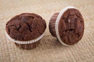 Chocolate chip muffin on wood table photo