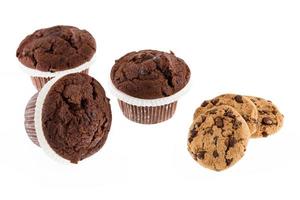 Chocolate chip muffin and cookies isolated on white background. photo