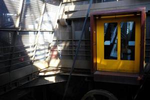 Yellow Elevator for Tourists at Eiffel Tower. photo