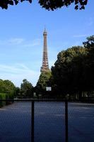 Scenery of Eiffel Tower from The Champ de Mars Field of Mars where is a large public green space in Paris, France. photo