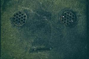 Close up Drainage Cover in Robot Face. photo