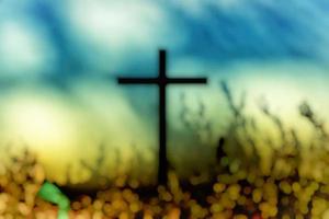 Abstract of Blurred Christ Cross in the Garden with Bokeh Background, Suitable for Christian Religion Concept. photo