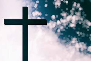 Abstract of Christ Cross Lighting with Bokeh Background, Suitable for Christian Religion Concept. photo