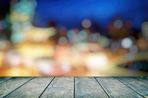 Wood Table with City Night Bokeh Background, Suitable for Product Display. photo