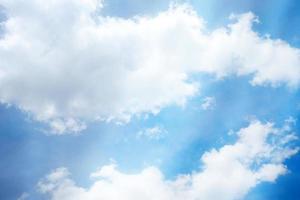 White Cloud with Blue Sky and Soft Light Leak Background. photo