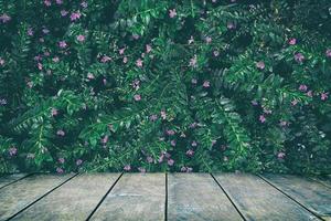 Wood Table with Tropical Leaves Texture in Dark Contrast Background., Suitable for Product Display and Natural Concept. photo