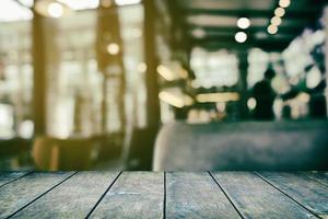 Old Wooden Table with Blurred of Restaurant Background. photo