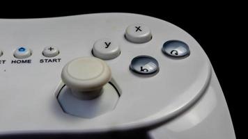 white joystick isolated black background photo