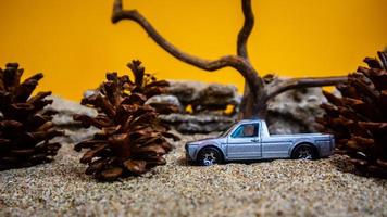 Minahasa, Indonesia  December 2022, the toy car among the pine cones photo