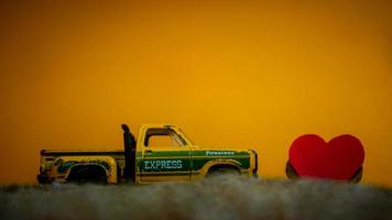 Minahasa, Indonesia  December 2022, the toy car with a heart in front of it photo