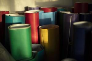 Rolls of colored paper. Self-adhesive film in rolls. Creative material. photo