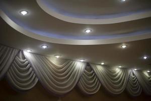 Beautiful ceiling with lamps. Vaulted ceiling. Interior wall design. photo