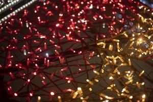 Red garlands. Texture made of LEDs. Bright lights. photo