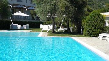 Little adorable girl in outdoor swimming pool video