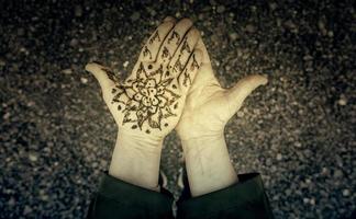 Henna tattoo on the hand photo