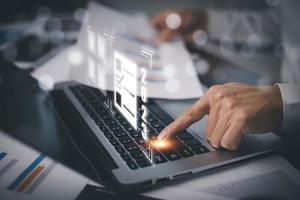 Concept Working and planning New year 2023, man using laptop and Smartphone with folder of document Management System, online documentation database, Business management photo