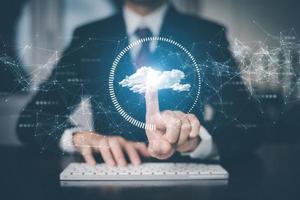 Businessman hand touch cloud computing diagram show on hand. Cloud technology. Data storage. Networking and internet service concept, Cloud sharing download and upload,Networking and internet service. photo