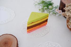 delicious rainbow cake slice as a background photo