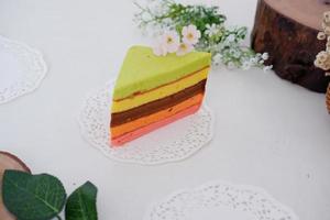 delicious rainbow cake slice as a background photo