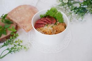 fried noodle crackers with sliced meat and vegetables photo