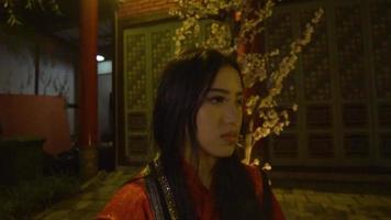 A Chinese Woman crying lonely in front of the flower video